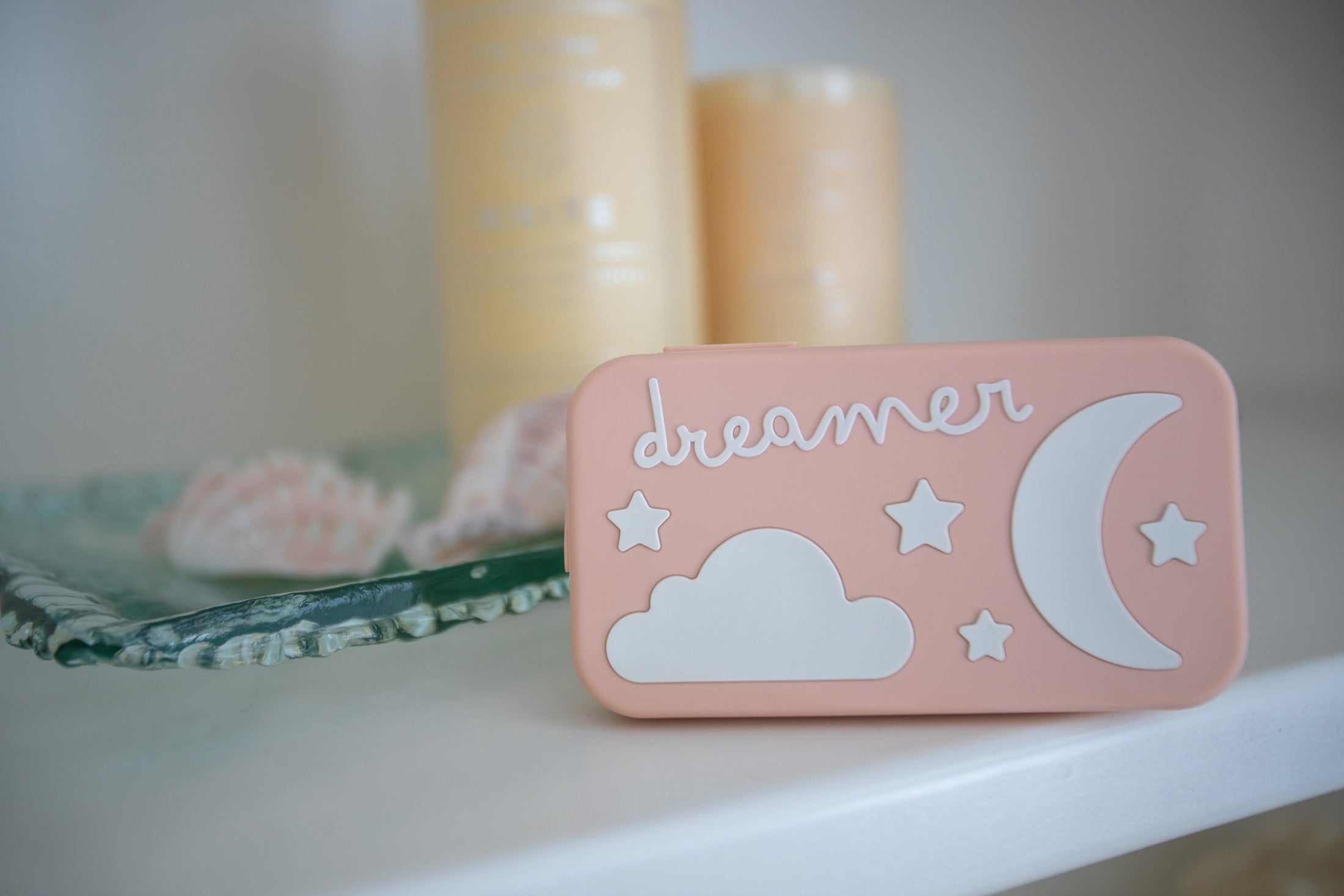 Dreamer baby sound machine on a white shelf (Peach-Dreamer)